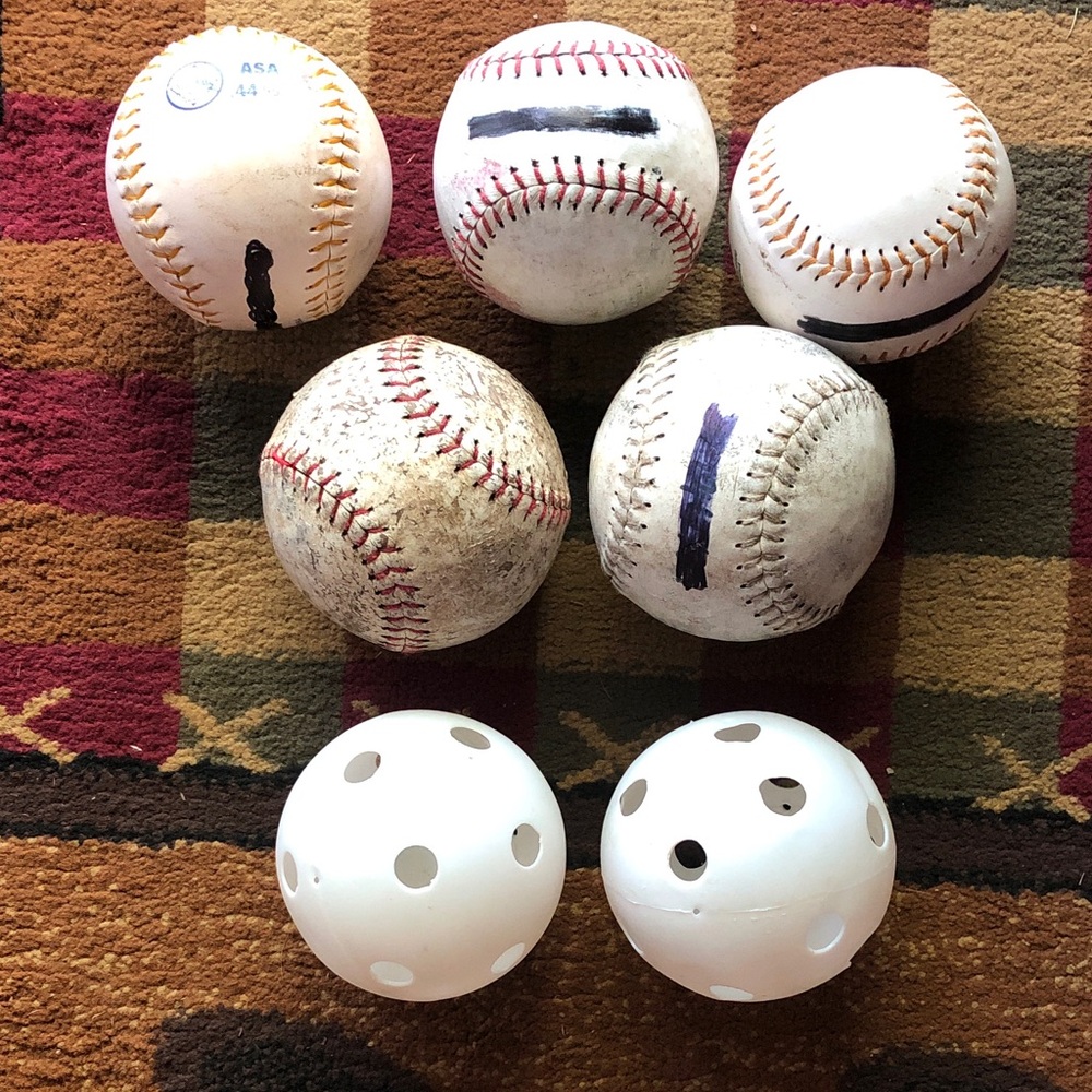 Used softballs  and Practice Wiffle Balls - White